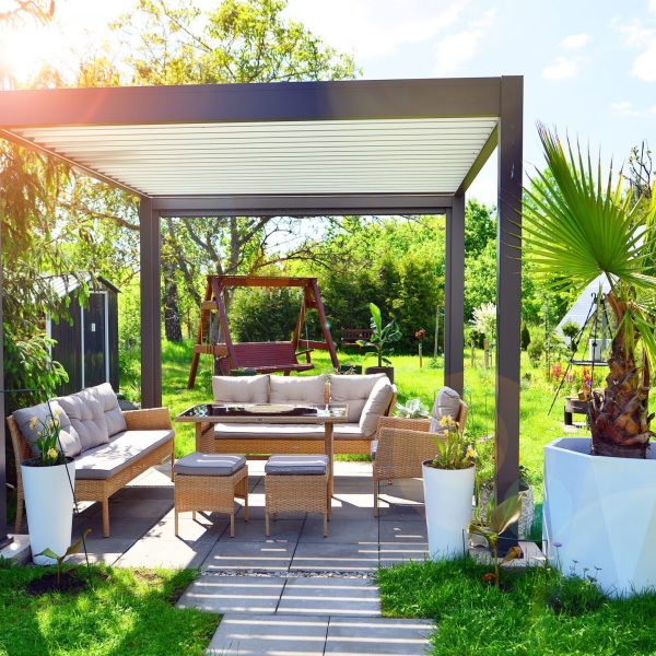 Modern,Aluminum,Pergola,With,Stylish,Garden,Furniture,In,A,Beautiful